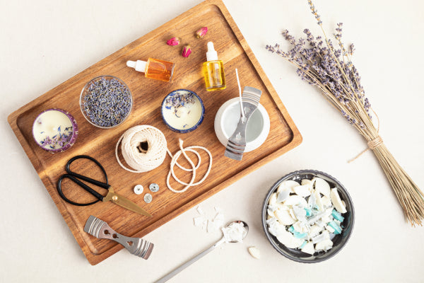 white Apple Magic Mouse beside of Magic Keyboard and headphones