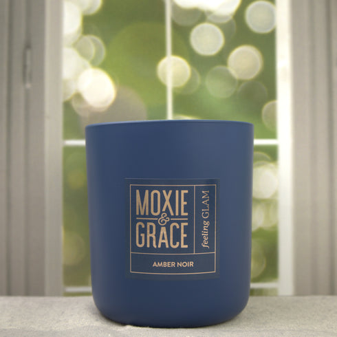 Amber Noir 12oz Candle in Navy by Moxie & Grace — a dark, sultry blend of amber, black oud, vetiver, patchouli, and smoked musk
