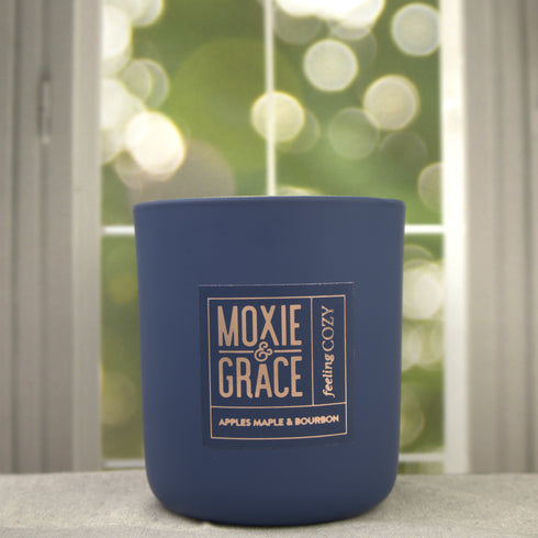 Apples Maple & Bourbon 12oz Candle in Navy by Moxie & Grace — a cozy harvest blend of apple, maple, bourbon, cinnamon, and vanilla
