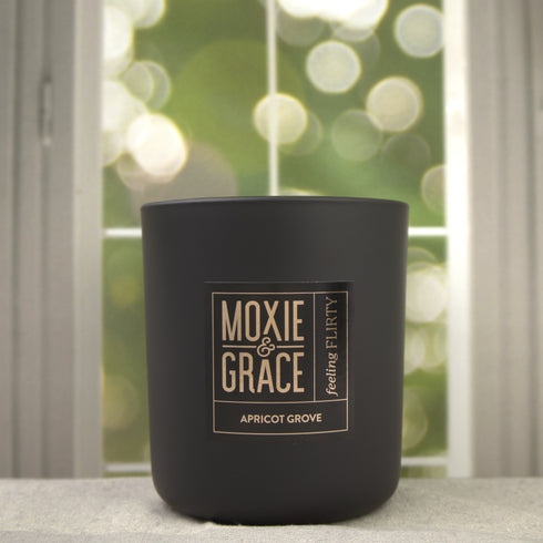 Apricot Grove 12oz Candle in Black by Moxie & Grace — a bright, sun-warmed blend of apricot, peach, jasmine, and soft musk