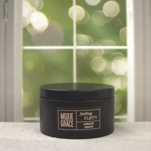 Apricot Grove 5oz Candle in Black by Moxie & Grace — a bright, sun-warmed blend of apricot, peach, jasmine, and soft musk