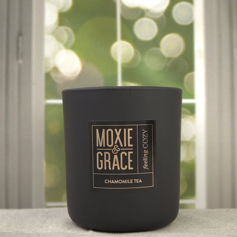 Chamomile Tea 12oz Candle in Black by Moxie & Grace — a calming blend of chamomile, honey, vanilla, and soft musk