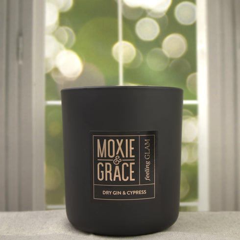 Dry Gin & Cypress 12oz Candle in Black by Moxie & Grace — a sophisticated blend of juniper, cedar, cypress, and leather-inspired notes