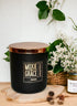 Fireside 12oz Candle in Black by Moxie & Grace — a warm, smoky blend of cedarwood, sandalwood, birch, and smoked amber