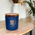 Fireside 12oz Candle in Navy by Moxie & Grace — a warm, smoky blend of cedarwood, sandalwood, birch, and smoked amber
