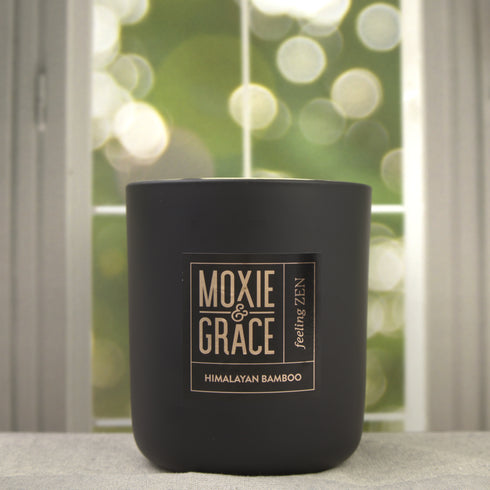 Himalayan Bamboo 12oz Candle in Black by Moxie & Grace — a serene, spa-inspired blend of bamboo, verdant florals, lemon, and pine