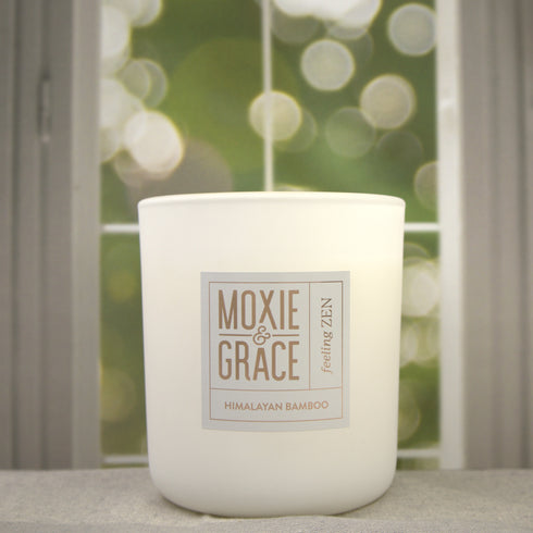 Himalayan Bamboo 12oz Candle in White by Moxie & Grace — a serene, spa-inspired blend of bamboo, verdant florals, lemon, and pine