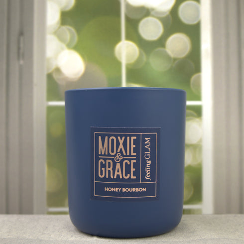 Honey Bourbon 12oz Candle in Navy by Moxie & Grace — a rich, warming blend of honey, bourbon, vanilla, amber, and oak