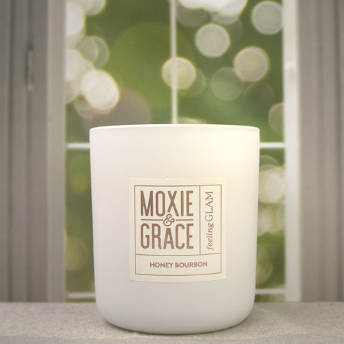 Honey Bourbon 12oz Candle in White by Moxie & Grace — a rich, warming blend of honey, bourbon, vanilla, amber, and oak