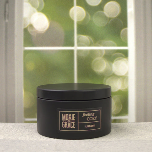 Library 5oz Candle in Black by Moxie & Grace — a sophisticated blend of teakwood, cedar, leather, sandalwood, and dark musk