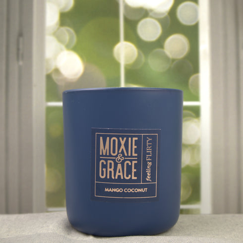 Mango Coconut 12oz Candle in Navy by Moxie & Grace — a tropical blend of ripe mango, coconut milk, vanilla, and warm musk