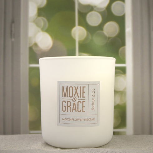 Moonflower Nectar 12oz Candle in White by Moxie & Grace — an enchanting blend of pear, agave, marine florals, dark musk, and amber