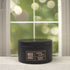 Sea Salt & Orchid 5oz Candle in Black by Moxie & Grace — a coastal floral blend of sea salt, freesia, orchid, tonka bean, and amber