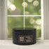 Sugar Pine & Patchouli 5oz Candle in Black by Moxie & Grace — an earthy, woodsy blend of pine, patchouli, cedar, and warm musk