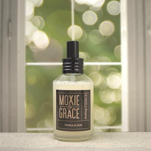 Tonka & Oud 4oz Room Spray by Moxie & Grace — a luxurious blend of oud, tonka bean, sandalwood, amber, and dark musk