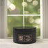 Woodland Snow 5oz Candle in Black by Moxie & Grace — a crisp, wintry blend of pine, cedarwood, eucalyptus, and fresh snow